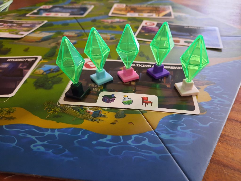 de 5 plumbobs van op het speelbord van the Sims bordspel
